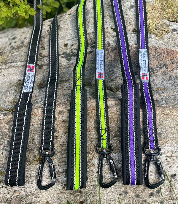 Huken reflective leash with padded handle and secure clip, designed for visibility and safety during nighttime walks.